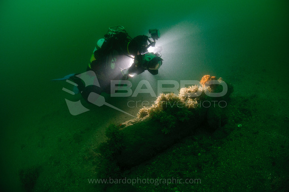 Underwater photographer and cannon