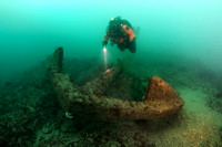 Diver near large anchor