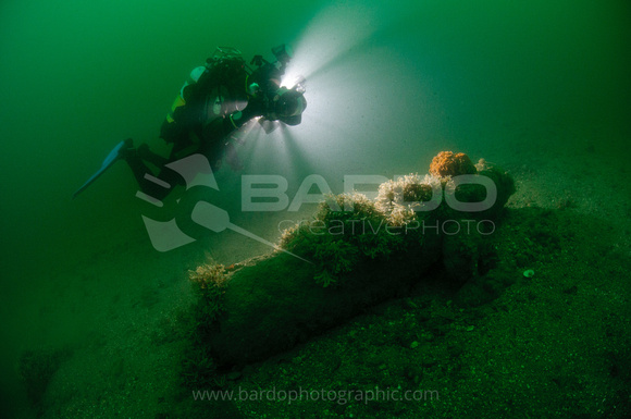Underwater photographer and cannon